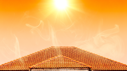 Hot summer day, steam is rising from the roof caused by the sun directly above it.